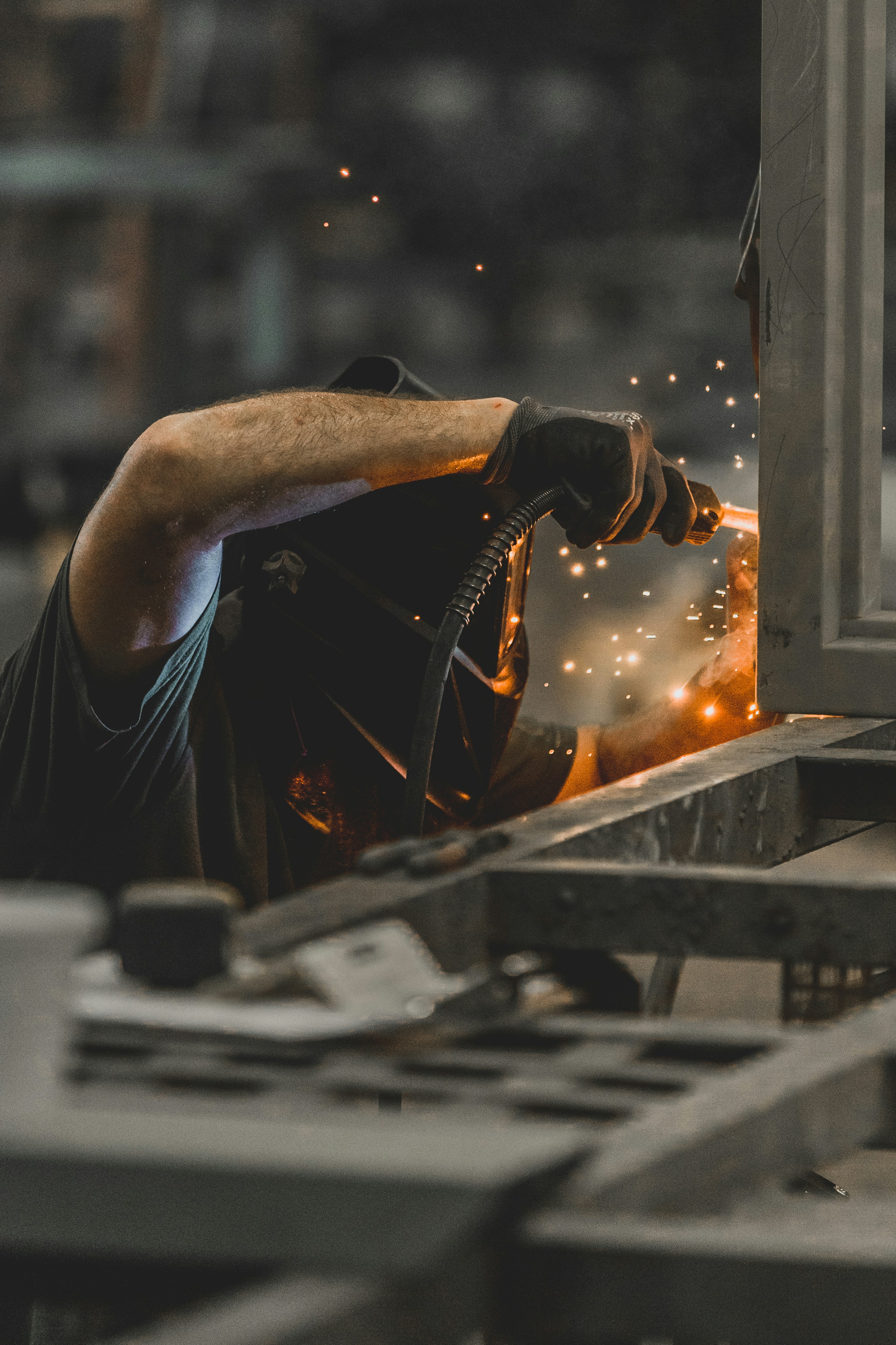 Welder working in a jig at a fabrication shop